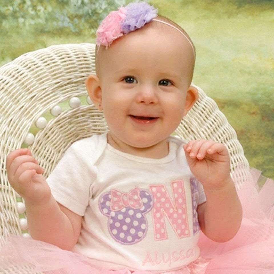 cute baby sitting in a vintage chair